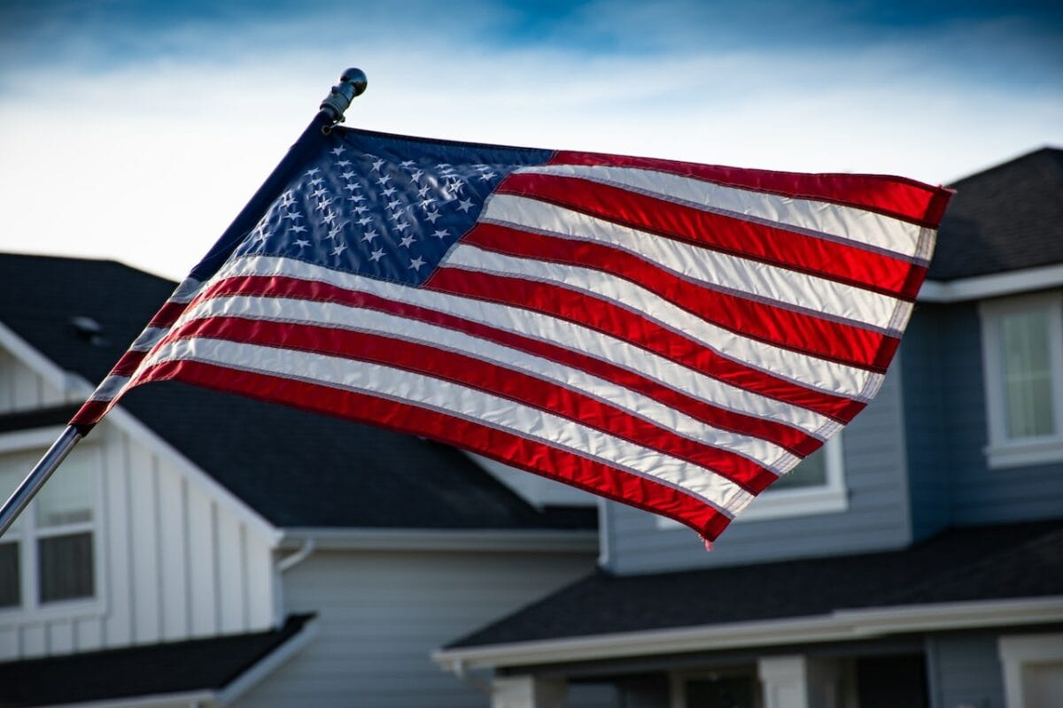 american flag in front of house